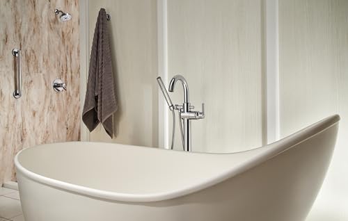 Polished nickel robe hook mounted on bathroom wall above bathtub with gray towel hanging from hook.