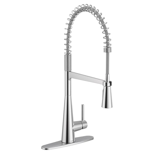 Chrome kitchen faucet with coiled pull-down sprayer and single lever handle mounted on base.