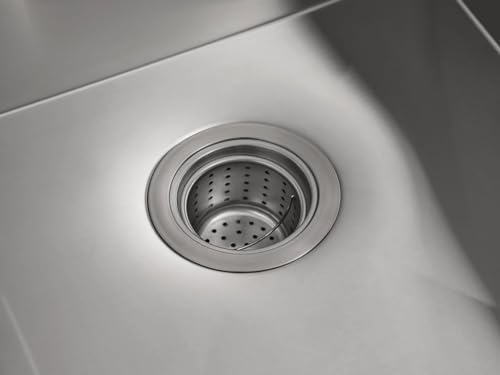 Stainless steel double bowl undermount kitchen sink with colander basket insert in one bowl.