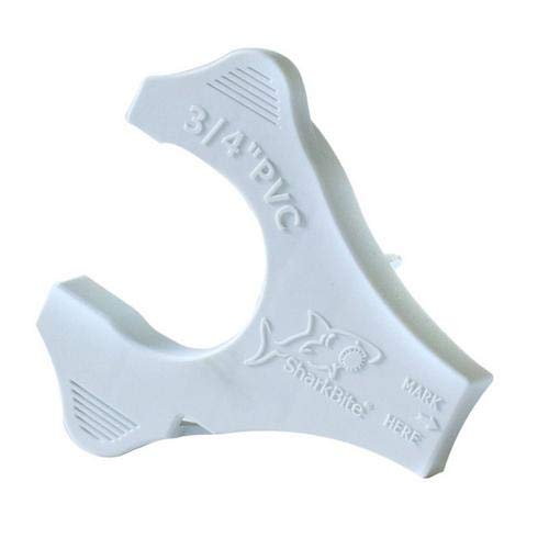 White PVC disconnect clip with Sharkbite branding and shark logo, featuring curved grip handles and textured grip surfaces.