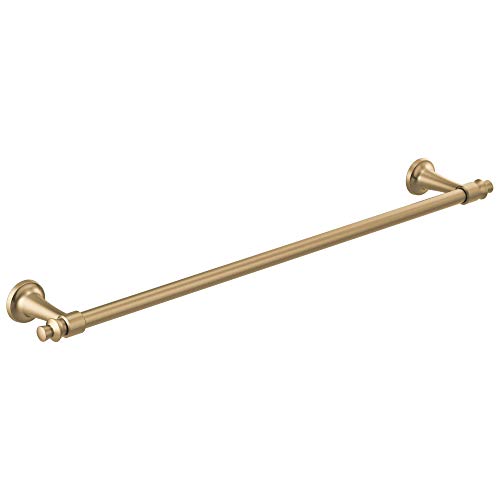 Champagne bronze towel bar with decorative round wall-mounted brackets at each end.