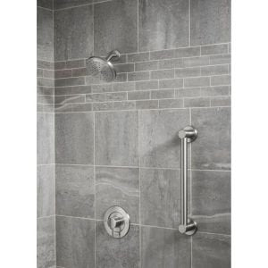 Brushed nickel 36-inch horizontal grab bar mounted on gray tile bathroom wall next to showerhead and valve controls.