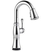 Chrome single-handle pull-down kitchen faucet with curved spout and lever control.