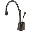 Contemporary instant hot and cold water faucet in mocha bronze with curved spout and dual handles.