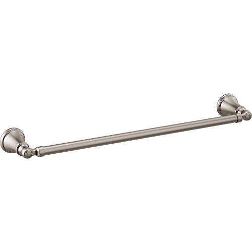 Brushed nickel towel bar with round decorative end caps mounted horizontally.