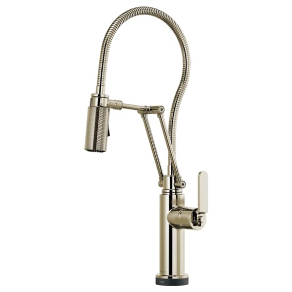 Chrome kitchen faucet with articulating spray hose and white lever handle on cylindrical base.
