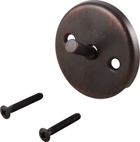 Champagne bronze circular overflow plate with trip lever and two mounting screws.