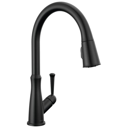 Black kitchen faucet with curved spout and pull-down spray head controlled by single side handle.