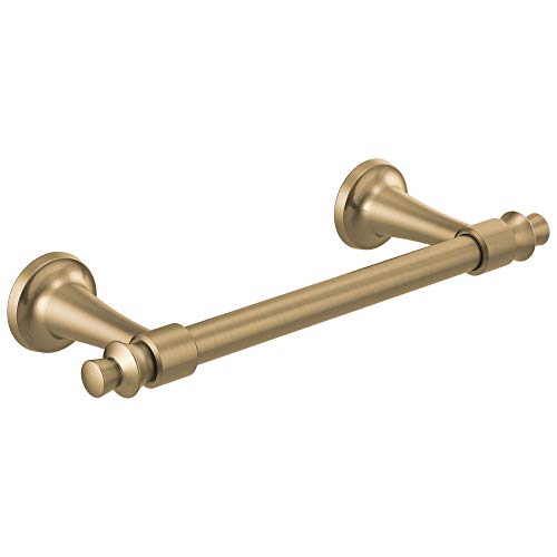 Brass towel bar with round wall mounts and decorative finials on each end.