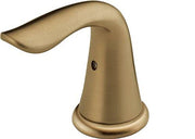 Champagne bronze metal lever handle with curved spout and round base for bathroom sink faucet.
