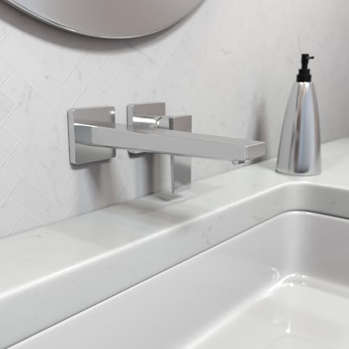 Chrome wall-mounted single-handle faucet with lever handle and rectangular spout above white sink basin.