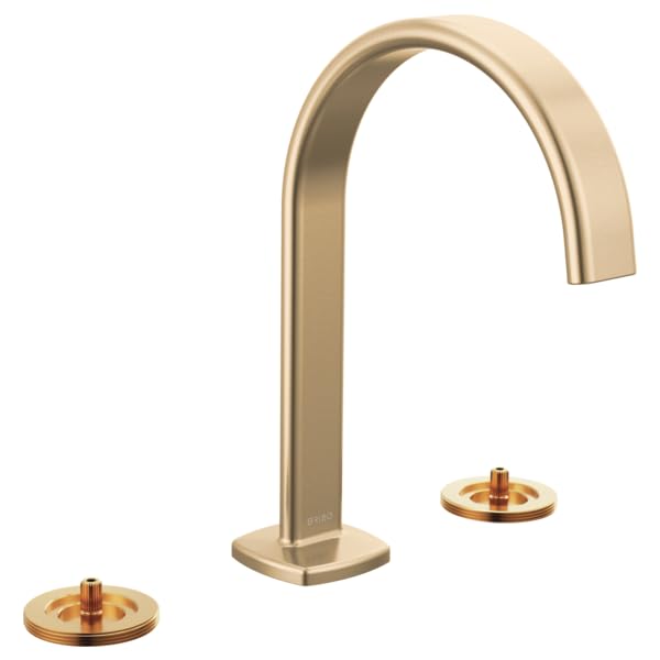 Brushed gold widespread lavatory faucet with tall arc spout and two round gold handles.