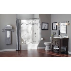 Brushed pewter grab bar mounted horizontally on gray bathroom wall next to shower enclosure.