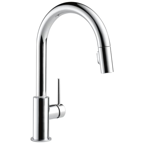 Chrome kitchen faucet with tall curved spout and single lever handle that pulls down.