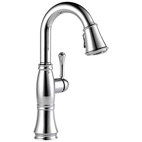 Chrome pull-down kitchen faucet with single lever handle and curved spout.