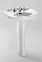 White pedestal sink with curved basin, three-hole faucet deck, and chrome faucet and handles.