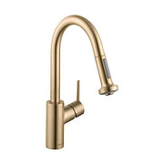 Brushed gold kitchen faucet with curved pull-down spout and single lever handle.