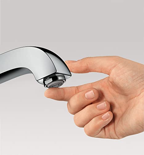Hand holding chrome faucet spout with aerator visible against gray background.