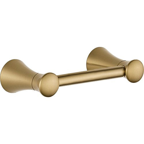 Brushed gold tissue holder with flared end caps and cylindrical rod, wall-mounted design.