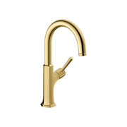 Brushed gold bar faucet with curved spout and single side lever handle.