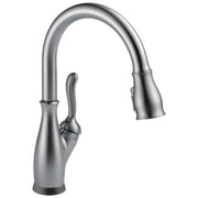 Stainless steel kitchen faucet with high curved spout, pull-down spray head, and single lever handle.