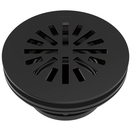 Matte black round shower drain with radial slot pattern and recessed basin design.