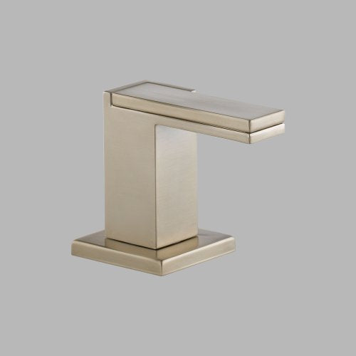 Brushed gold widespread lavatory faucet with rectangular spout and lever handle on square base.