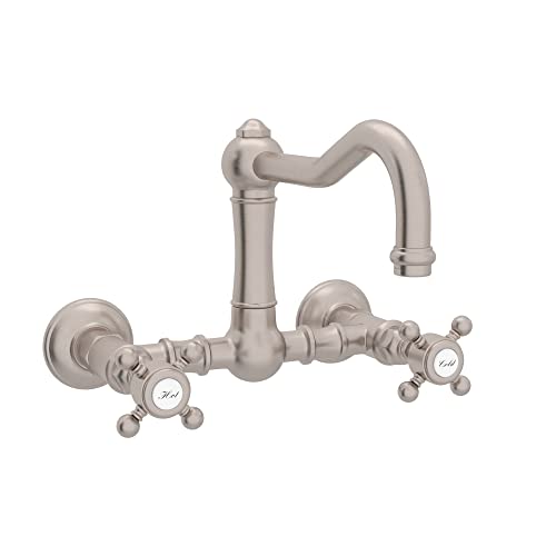 Satin nickel wall-mounted bridge kitchen faucet with curved column spout and cross handles.