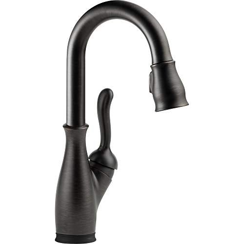 Matte black single-handle pull-down kitchen faucet with curved spout and textured grip.