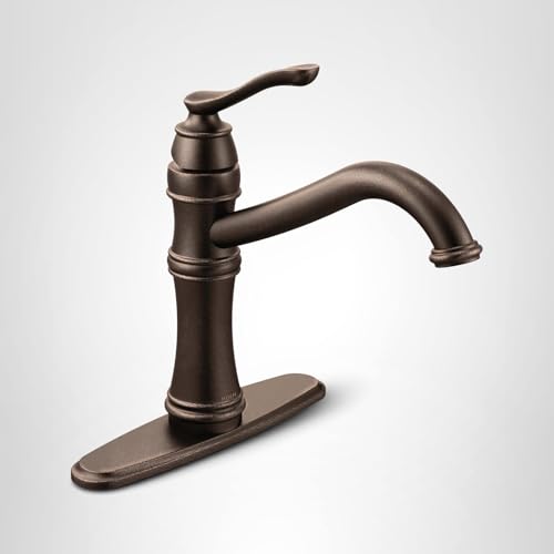 Oil rubbed bronze single-handle kitchen faucet with high arc spout and matching deck plate on white background.