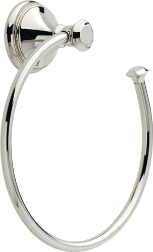Polished chrome circular towel ring mounted on wall with decorative backplate and finial post.