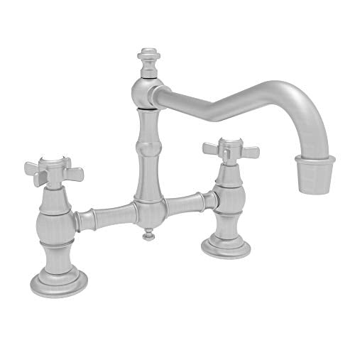 Satin nickel bridge kitchen faucet with two cross handles and a curved spout.