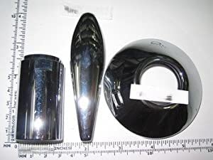 Chrome reversing lever with flange and cylindrical components displayed against ruler for scale.
