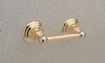 Polished chrome toilet paper holder with spring-loaded mechanism and decorative fluted mounting flanges mounted on gray wall.