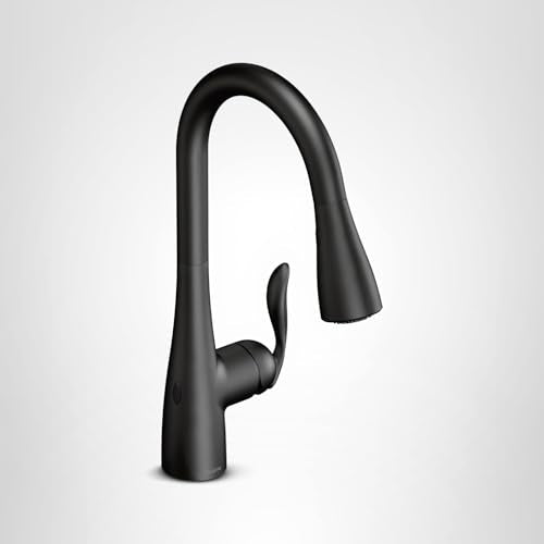 Matte black single-handle pulldown kitchen faucet with curved spout and lever control.