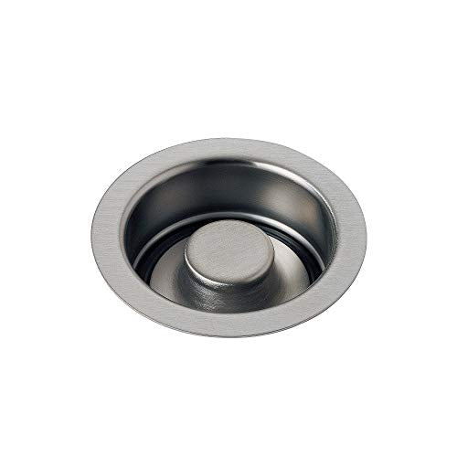 Stainless steel sink flange with round stopper button, brushed finish.