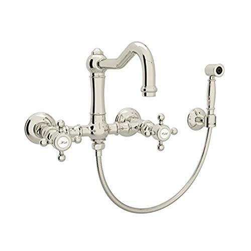 Polished nickel wall-mount bridge kitchen faucet with curved spout, dual handles, sidespray, and flexible hose.