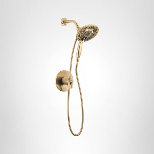 Champagne bronze shower trim with fixed overhead showerhead and handheld shower head with curved arm and wall-mounted control