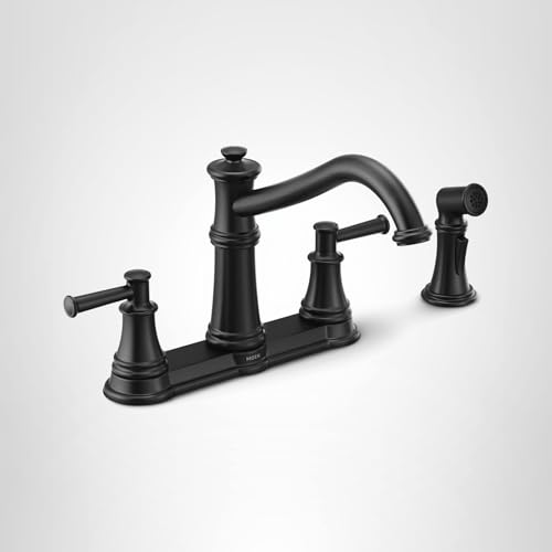 Matte black two-handle kitchen faucet with high arc spout and detachable side spray on deck plate.