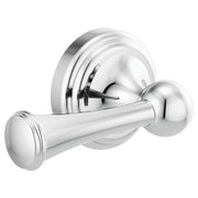 Chrome toilet flush lever with cylindrical handle and circular mounting plate against white background.