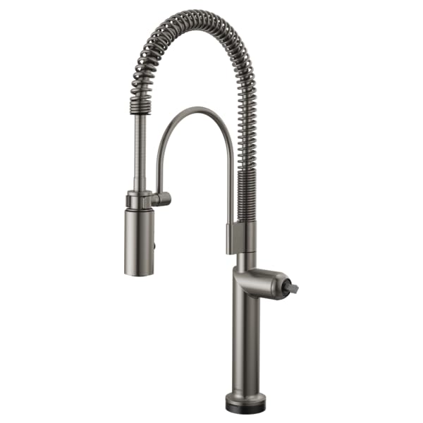 Stainless steel kitchen faucet with flexible coiled spray head and single rigid spout.