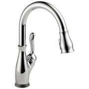 Chrome single-handle kitchen faucet with curved pull-down spout and lever handle.