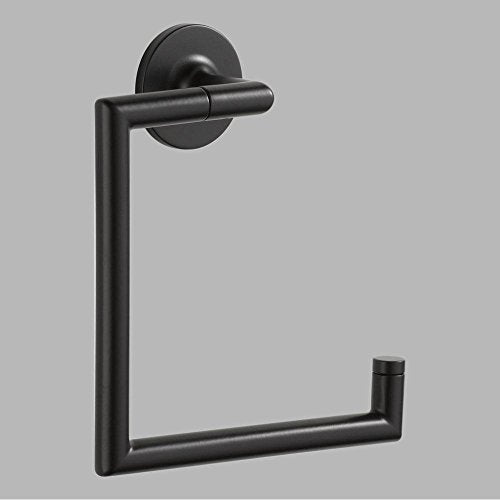 Matte black towel ring with cylindrical handle mounted on circular backplate and vertical post.