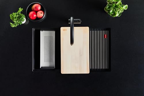 Black granite undermount kitchen sink with single bowl, strainer basket, and wooden cutting board accessory.
