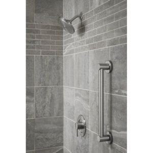 Brushed nickel 36-inch stainless steel grab bar mounted vertically on tiled shower wall next to showerhead.