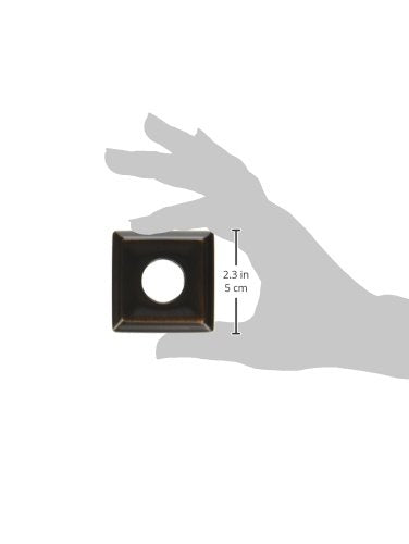 Square Venetian bronze shower flange with center hole, shown in hand with 2.3 inch dimension marked.