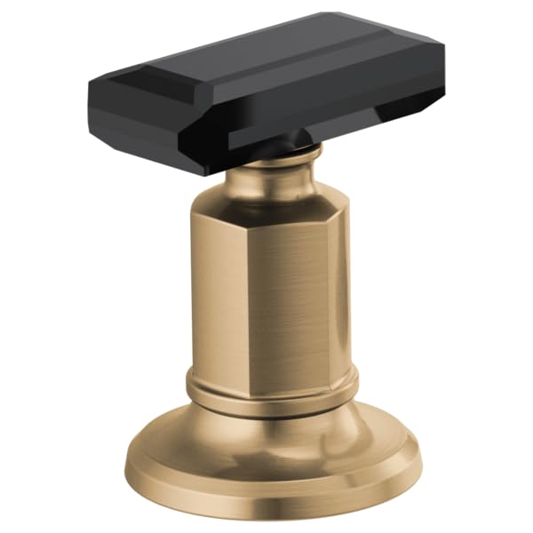 Black crystal knob handle mounted on brushed gold cylindrical base with round foot for lavatory faucet.