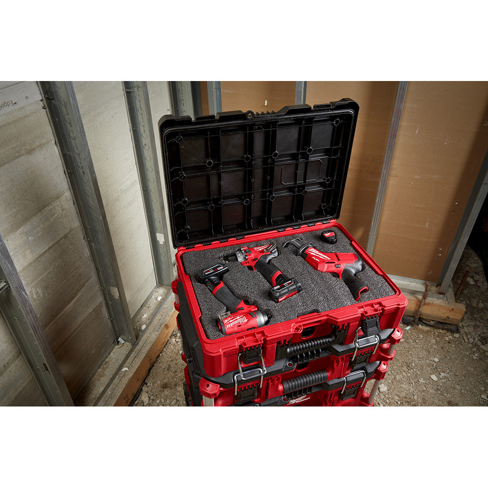 Black foam insert with cutouts for tools, fitted inside red PACKOUT storage case with black lid.