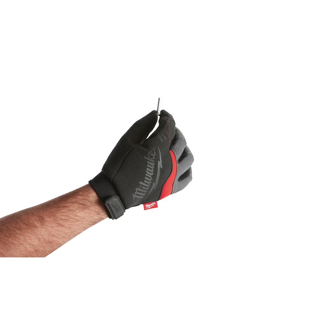 Black and red Milwaukee work glove with padded palm on male hand, wrist strap visible.