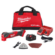 Milwaukee M18 FUEL oscillating multi-tool kit with red canvas bag, charger, battery, accessories, and sanding pads.